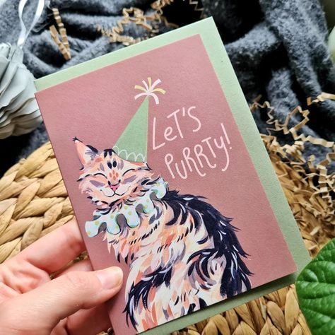 I am running extremely low on these kitty cat cards now! The Let's Purrty card has definitely been the most popular out of the whole new card collection launch. I will be ordering more, but I wanted to get some new designs whilst I am at it, so I have been working on some new cards lately 😁 I will be revealing them soon! Image: A greeting card featuring a smiling, long-haired cat, wearing a birthday party outfit with a paper hat, and text that says Let's Purrty. #catcard #catbirthdaycard #... Cat Lovers Birthday Cards, Pet Greeting Cards, Gouache Birthday Card, Creative Greeting Card Design Ideas, Cat Birthday Cards, Cat Lover Birthday, Birthday Postcard, Birthday Party Outfit, Creative Birthday Cards