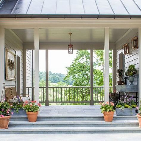 Southern Living Idea House Charlottesville Bunny Williams There’s a large oversize soapstone sink designed by the architect in the “dogtrot” space between the garage and back door:  ￼  “It’s a great place to arrange flowers or to wash up before going inside, Screened Porch Between House And Garage, Covered Area Between House And Garage, Covered Patio Between House And Garage, Area Between House And Garage, Garage And Breezeway Addition, Porch Breezeway To Garage, Porch Connecting House To Garage, Breezeway Porch Ideas, Screened In Porch Between House And Garage