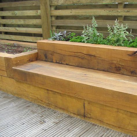 Timber sleeper seating Back Garden Designs Uk, Sleeper Bench, Making Raised Garden Beds, Wooden Seating, Sleepers In Garden, Bench Bed, Bed Idea, Garden Seating Area, Raised Flower Beds