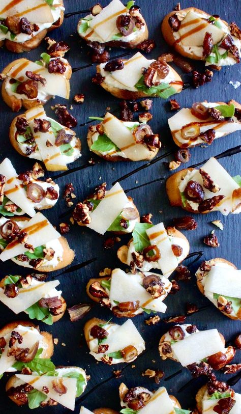 Mini homemade crostini slathered with a creamy honey goat cheese spread and topped with crisp Asian pears and all the good textures: these Whipped Honey Goat Cheese, Pear, and Balsamic Crostini are my favorite party appetizer!  #onanniesmenu #eathealthy #healthyrecipes #eatrealfood #crostini #easymeal #foodporn #healthyish #eatwellbewell #realfoodz #wholefoodie #easyappetizer #goodeats #healthyfoods #foodblog #foodcoma #comfortfood #fingerfood #whippedgoatcheese #whippedricotta #partyappetizer Pear And Goat Cheese Crostini, Balsamic Crostini, Homemade Crostini, Pear Crostini, Goat Cheese Spread, Crostini Appetizer, Honey Goat Cheese, Favorite Party Appetizers, Chevre Cheese