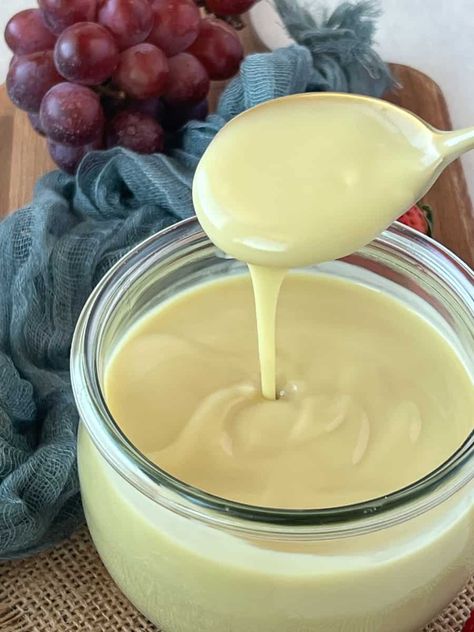 A glass bowl of custard sauce with a spoonful drizzling over it. Vegan Custard, Vanilla Custard Recipe, Homemade Sweetened Condensed Milk, Oat Recipes, Chocolate Festival, Filled Donuts, Custard Cake, Custard Recipes, Amish Recipes