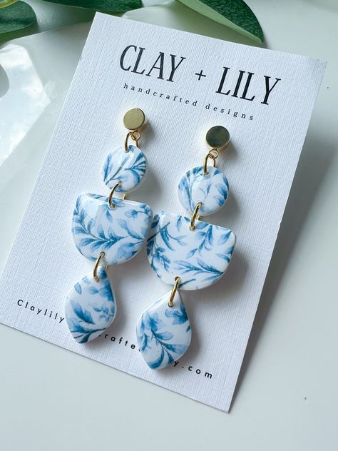 Floral earrings | Summer | lightweight earrings | blue | hypoallergenic | gifts for her| clay dangle earrings | vacation They are lightweight, simple yet elegant, and will pair well dressed up or down.  Each piece is hand crafted out of polymer clay, which is a very delicate, lightweight and comfortable material. Every pair is one of a kind Care Instructions: Store in a clean, dry place. Use of oils, creams, perfumes etc may affect longevity. Do not wear in water. May break if dropped or bent. To clean polymer clay pieces, rub gently with a soft, wet piece of cloth. If you own a white or light colored pair of earrings and you get makeup stains on them, nail polish remover will clean it off. Treat these earrings gently just as you would any other piece of jewelry! Please keep in mind that w Blue And White Clay Earrings, Blue Clay Earrings, Blue And White Earrings, Polymer Clay Flower Jewelry, Clay Dangle Earrings, Clay Pieces, Blue Clay, Nails Today, Polymer Clay Jewelry Diy