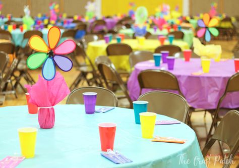 These DIY colorful, easy and inexpensive party centerpieces can be used and reused for backyard barbecues, church socials or birthday parties. Most of the materials can be purchased at the dollar store! Cheap Birthday Centerpieces Diy, Spring Fling Decorations Dance, Pinwheel Party Decorations, Cheap Party Table Decorations, Spring Fling Decorations Diy, Colorful Retirement Party Ideas, Simple Birthday Party Centerpieces, Pinwheel Centerpiece Ideas, Spring School Dance Decorations