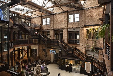 Heritage preservation and adaptive reuse of historic warehouse provides new offices and showrooms, with central café in large atrium Warehouse Loft, Warehouse Living, Warehouse Office, Warehouse Home, Warehouse Design, Stil Industrial, Industrial Architecture, Casa Container, Adaptive Reuse