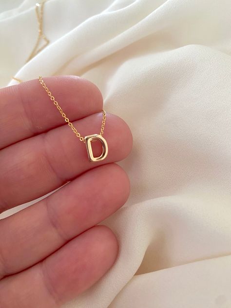 **Each piece in my shop, I personally create and photograph. (All photos are property of The Cord Gallery LLC) Thank you for supporting my small business. Tiny Gold Initial Necklace -  Gold Filled Now all Gold Filled - Waterproof!! Add a personal touch to your accessories collection with this Dainty Gold Initial Necklace!  Features a 18k Gold Filled Mini Initial Letter. Each letter is 3D for added interest and texture and hangs seamlessly on your choice of Gold Filled Link or Gold Filled Box cha Letter Charm Necklace, Gold Initial Necklace, Gift Idea For Women, Padlock Necklace, Initial Necklace Gold, Waterproof Jewelry, Chain Extenders, Gold Initial, Accessories Collection