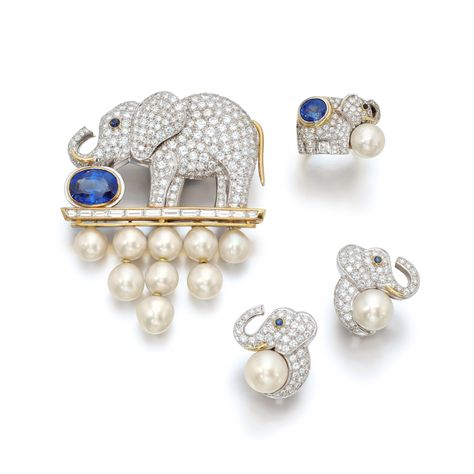 Comprising: a brooch designed as an elephant pavé-set with brilliant-cut diamonds, the eye collet-set with a cabochon sapphire, enhanced with baguette diamonds, featuring a collet-set oval sapphire, supporting round and button-shaped cultured pearls, signed Ellagem, Italian assay marks for gold; a pair of earrings, each designed as an elephant pavé-set with brilliant-cut diamonds, the eye collet-set with a cabochon sapphire, to a round cultured pearl, post and hinged back fitting Diamond Parure, Jewelry Design Drawing, Pearl And Diamond Ring, Baguette Diamonds, Diamond Brooch, An Elephant, Diamond Bangle, Blue Agate, Yellow Sapphire