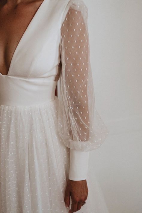 A Sassi Holford wedding dress with long sheer sleeves with polka dots on with a deep neckline Polka Wedding Dress, Swiss Dot Wedding Dress Sleeves, Spotty Wedding Dress, Dotted Wedding Dress, Long Sleeve Wedding Dress With Pearls, Sassi Holford Wedding Dress, Wedding Dress With Pearl Sleeves, Swiss Dot Wedding Dress, Wedding Overlay