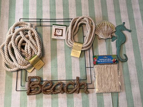 how to make a dollar tree coastal wreath Coastal Wreaths Front Doors Diy, Nautical Rope Wreath Diy, Nautical Wreath Diy, Diy Nautical Wreath, Beach Wreath Ideas Diy, Coastal Wreaths Beach Themes, Coastal Door Wreath, Diy Metal Wreath, Beach Wreath Ideas