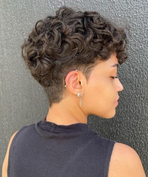 Put-Together Short Curly Undercut Hairstyle Low Fade Curly Hair Women, Short Curly Hairstyles Shaved Sides, Short Curly Fade Women, Short Curly Hair Undercut Woman, Curly Hair With Shaved Side, Short Curly Hair Fade, Short Pixie Haircuts For Curly Hair, Short Hair Perm Pixie Cuts, Curly Undercut Women