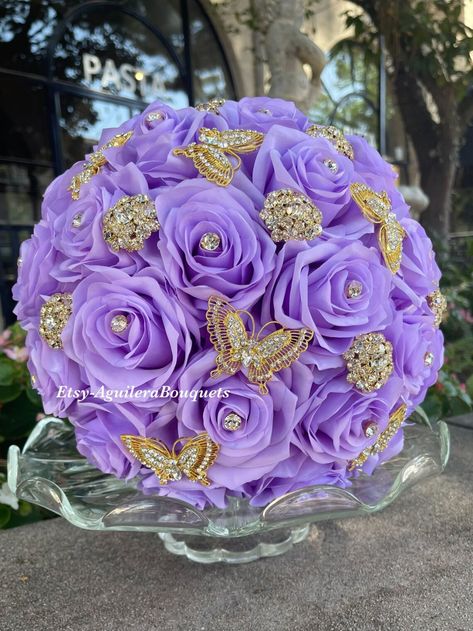 El Ramo de la Quinceanera | Choosing Your Quinceanera Bouquet Purple Quinceanera Ideas, Lilac Quince, Lilac Bridal Bouquet, Butterfly Quinceanera Theme, Quince Bouquet, Purple Quinceanera Theme, Butterfly Quince, Bouquet Butterfly, Lavender Quinceanera Dresses