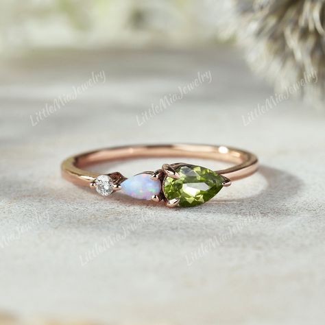 Vintage Pear Peridot Engagement Ring Art Deco Opal Rings For Women Peridot Wedding Ring Unique 3 Stone Opal Promise Ring Birthstone Ring ◆RING DETAILS: ❃Wedding Band: Centre Stone: Stone: Peridot  Shape: Pear Cut Weight: About 0.13ct ❃Band Width:1.6mm ◆All ring sizes are available, If you can't find your ring size in the list, please feel free to contact me. ◆Metal Options. Available in Sterling silver and 10k/14k/18k yellow gold, white gold, and rose gold.  ◆Other metals and stones are also available, please feel free to contact me. ◆Production & Shipping: It usually takes 2-3 weeks to make and 3-6 days to ship if you are in US. If you would like to receive your ring by the specified date, please contact me!  After the ring is finished, we will send you some photo about the ring. ◆Return Opal And Peridot Ring, Peridot Ring Silver, Peridot Engagement Rings Vintage, Peridot Wedding Ring, Peridot Ring Gold, Peridot Engagement Ring, Opal Promise Ring, Peridot Engagement Rings, Wedding Ring Unique