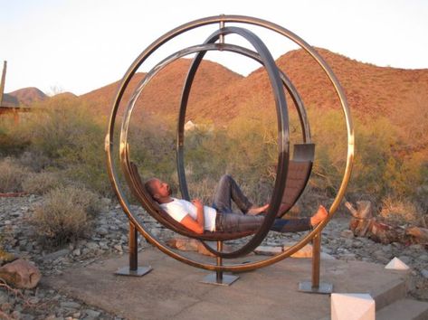 This Spinning Chair/Sculpture Lets You Rotate Your Views Backyard Hammock, Garden Hammock, Outdoor Living Design, Cozy Chair, Inexpensive Furniture, Hammock Stand, Sculpture Metal, Hammock Chair, Decoration Inspiration