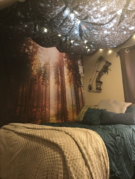 Forest tapestry along the wall with a galaxy tapestry as a canopy with fun string lights provides such a relaxing ambience Galaxy Tapestry, Ceiling Tapestry, Glow Worm Cave, Bedroom Tapestry, Crib Decor, Forest Tapestry, Tapestry Bedroom, Room Redesign, Brown Walls