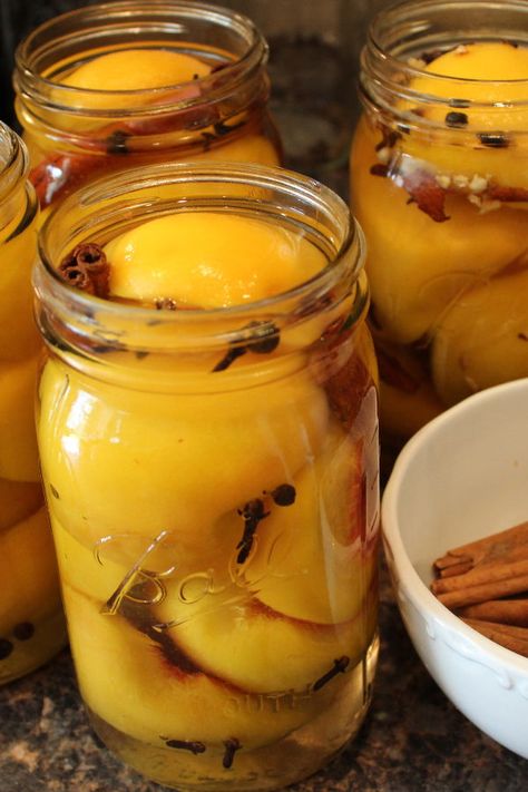 My grandma, Madge, was famous for these sweet, spicy home canned peaches! I share her simple recipe along with all the modern canning know how every beginner canner needs to get off to an easy start! This is a great recipe to learn how to can peaches AND the vintage treat is a great addition to the holiday table or the perfect Christmas / hostess gift! #canning #peaches #vintagerecipe #homemadegift #foodgift Spiced Peaches Canning Recipe, Home Canned Peaches, Canned Peaches Recipes, Canned Jam, How To Can Peaches, Fermenting Recipes, Can Peaches, Pickled Peaches, Spiced Peaches