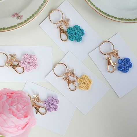 🌸✨ Step into a whimsical tea party straight out of the Regency era! ✨🌸 Our handmade crochet flower and bee charm keychains 🐝💐 bring a touch of elegance to your everyday accessories. Inspired by vintage charm and the timeless beauty of tea parties, these keychains are a sweet nod to days filled with delicate florals and a hint of luxury. Choose your favorite flower color and carry a bit of nature’s beauty with you, complete with a golden bee 🐝 that sparkles with tiny crystals on its abdomen.... Crochet Flower Keychain, Whimsical Tea Party, Custom Bridal Party Gifts, Mine Love, Flower Keychain, Bee Mine, Favorite Flower, Gold Bee, Regency Era