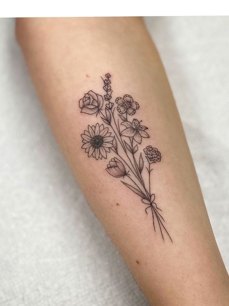 Five Flower Bouquet Tattoo, Black And White Birth Flower Tattoo, Sunflower And Rose Bouquet Tattoo, Simple Sunflower Bouquet Tattoo, Small Floral Forearm Tattoo Women, Five Flowers Tattoo, Flower Arrangements Tattoo, Mixed Flower Bouquet Tattoo, 7 Flower Bouquet Tattoo