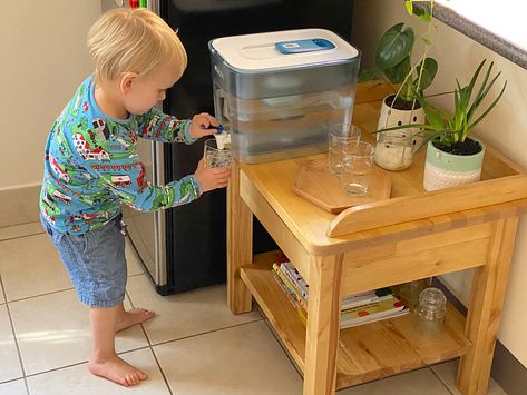 Montessori For Small Spaces, Kids Montessori Kitchen, Toddler Get Ready Station, Diy Montessori Kitchen Station, Montessori Kitchen Station With Mini Fridge, Montessori Kitchen Station, Montessori Mini Fridge, Montessori Kitchen Toddler, Montessori Kitchen