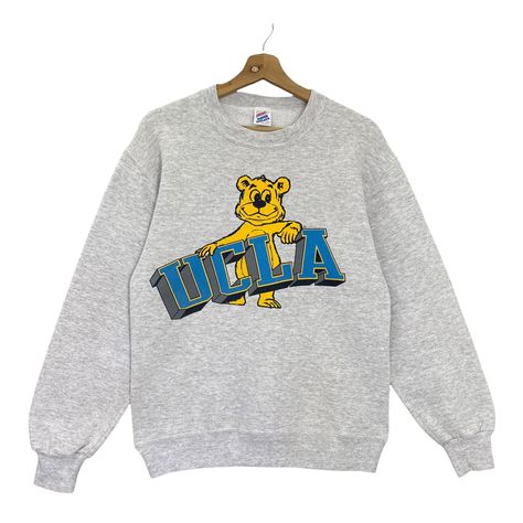 College Sweatshirt Aesthetic, Vintage School Shirts, School Merch Ideas, College Merch Ideas, Vintage College Shirts, School Tshirt Designs, Ucla Sweatshirt, Los Angeles Sweatshirt, Vintage College Sweatshirts