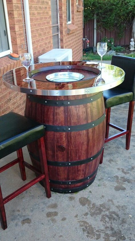 Wine barrel table/bar, with concealed ice bucket under the lid to keep drinks cool. Wine Barrel Table Diy, Barrel Table Diy, Wine Barrel Bar Table, Aiken Drum, Wine Barrel Diy, Whiskey Barrel Table, Wine Barrel Bar, Home Bar Table, Wine Barrel Table