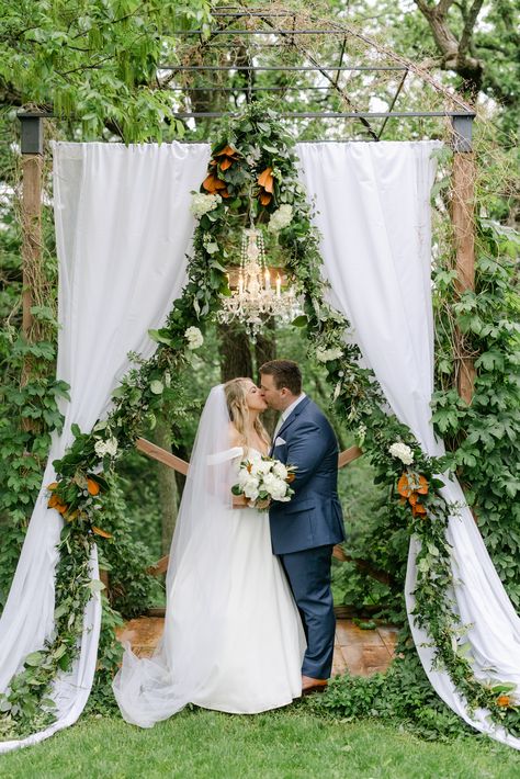 Romantic spring wedding at Diamond Oak Events Wedding Venue in Clear Lake, IA. Beautiful wedding centerpieces with magnolia leaves and white florals inside rustic barn. Neutral monochromatic elegant wedding with magnolia wedding bouquet Magnolia Wedding Arch, White Floral Wedding Decor, Magnolia Leaf Wedding, Magnolia Wedding Bouquet, Magnolia Leaves Wedding, Magnolias Wedding Bouquet, Clear Lake Iowa, Floral Wedding Decor, White Barn Wedding