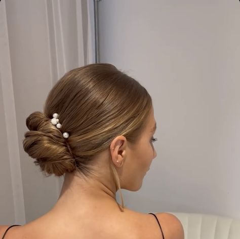 Low Bun Wedding Hair Minimal, Middle Part Low Bun Bridal Hair, Bridesmaid Sleek Bun, Slick Low Bun Wedding Hair, Clean Bridal Bun, Bridal Slick Bun, Low Bun With Pearls, Sleek Updo Wedding, Elegant Low Bun Wedding