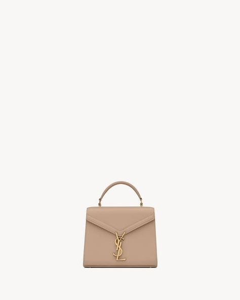 CASSANDRA Mini top handle bag in grain de poudre embossed leather | Saint Laurent | YSL.com Mini Top Handle Bag, Mini Top, Dark Beige, Handle Bag, Embossed Leather, Emboss, Luxury Bags, Top Handle, Saint Laurent