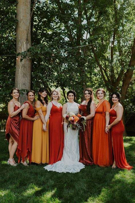 This stunning wedding party wore all orange, red, and yellow outfits!  #queerweddingparty #lgbtqwedding #weddingparty #weddingpartyoutfit #womenssuit #genderneutralweddingparty #weddingpartyideas #nongenderedweddingparty #summerwedding #bridesmaids #bridesmaidsdresses #lgbtqweddingparty #gaywedding #gayweddingparty #gayweddingoutfit #lgbtqweddingoutfit #samesexwedding #samesexweddingparty #wedding #weddingoutfit #weddinginspo #weddingpartyphoto #weddingday #summerwedding #lgbtqweddingoutfit Red Yellow Orange Wedding, Orange Wedding Party, Orange Red Wedding, Orange Bridal Party, Red And Yellow Wedding, Red And Orange Wedding, Yellow And Orange Wedding, Blue Red Wedding, September Wedding Colors