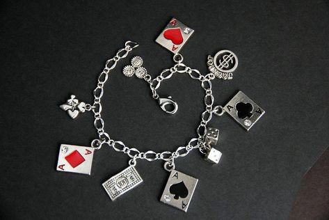 A collection of silver plated gambling and poker themed charms have been dispersed around a shimmering silver plated bracelet chain in this handmade charm bracelet.   This gambler charm bracelet is then completed with a lobster clasp and a 1/2 inch of chain at the end for adjustable sizing.   Charms in this bracelet include four ace card charms, a pair of dice charms, a card suit charm, jackpot charm, a poker chips charm, and a $100 bill charm. ● Sizing ● To determine your bracelet size, do a sn Poker Accessories, Handmade Charm Bracelets, Lizzie Hearts, Cheap Diamond Rings, Rustic Crafts, Girl Pfp, Valentines Sale, Silver Plated Bracelet, Earrings Diy