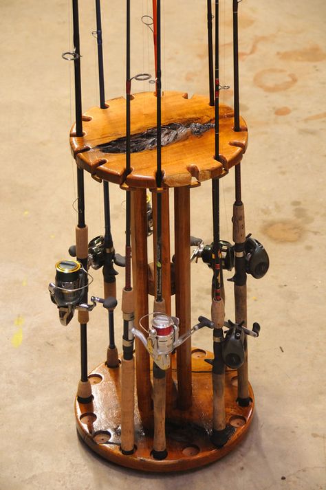 Solid Mesquite rod and reel holder. This Rod holder holds 16 rods and has a individual lock for each rod.  Mounted on a "Lazy Susan" so the entire unit spins to get the equipment in front of you. Fishing Pole Rack, Fishing Pole Storage, Fishing Rod Stand, Fishing Rod Holders, Fishing Pole Holder, Fishing Storage, Fishing Rod Storage, Fishing Rod Rack, Rod Rack