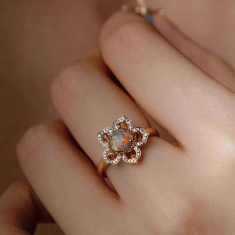 I designed this engagement ring inspired by Tang Dynasty flower art, a golden age for Chinese art. The vibrant Lightning Ridge black opal serves as the main stone, adorned with 70 diamonds on the petals, merging ancient art with a modern look. #JewelryLove #Engagement #rings #opalrings #JewelryArt #uniquelove #ring #EngagementRing #FineJewelry #opals #OpalRing #opal #OpalLove #DiamondRing #UniqueDesign #JewelryLovers #opaljewelry #JewelryMagic #opal #ring #rings #engagement #engagementring ... Lightning Ridge Black Opal, Tang Dynasty, Rings Engagement, Lightning Ridge, Opal Ring, Black Opal, Opal Jewelry, Ancient Art, Opal Rings