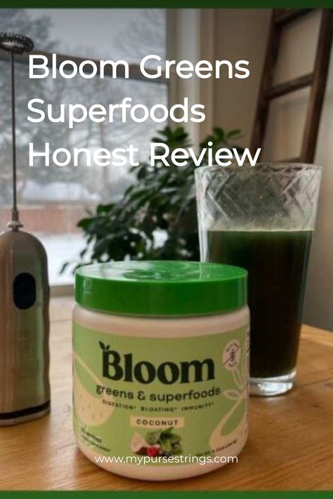 A glass of green juice next to a container of Bloom Greens & Superfoods with the label facing forward, placed on a table with a snowy background visible through the window. Bloom Powder Recipes, Bloom Powder Drink, Bloom Smoothie, Bloom Greens Powder Recipe, Coconut Powder Recipes, Bloom Greens, Superfoods Powder, Superfoods Benefits, Greens Supplement