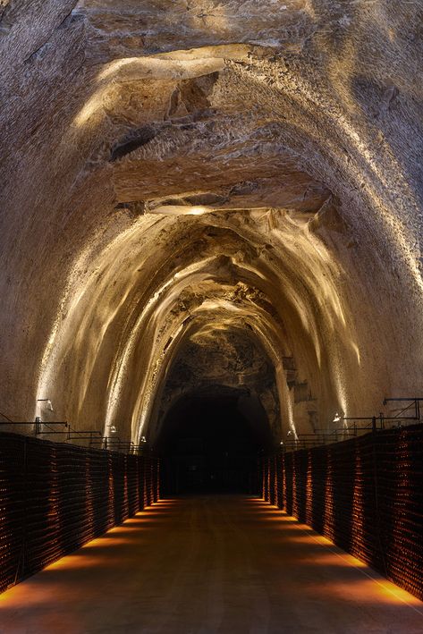 Caves Champagne Joseph Perrier - L&L Luce&Light Illusion Architecture, Parisian Lighting, Cave Architecture, Cave Library, Champagne France, Architectural Lighting Design, Covered Walkway, House Light, Corridor Lighting