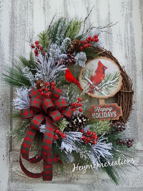 This beautiful Rustic Cardinal Christmas wreath is made on an 18" grapevine base with snowy pine greenery, red berries, iced twigs, pinecones, happy holiday cardinal sign and a pretty green and red ribbon bow with a red bird perched on a limb. -Measures Approx: 25"Lx22" W Grapevine Christmas, Red Christmas Wreath, Winter Wreath Diy, Christmas Decorations Centerpiece, Floral Door Wreaths, Burlap Wreath Diy, Cardinal Christmas, Rustic Christmas Wreath, Christmas Mesh Wreaths