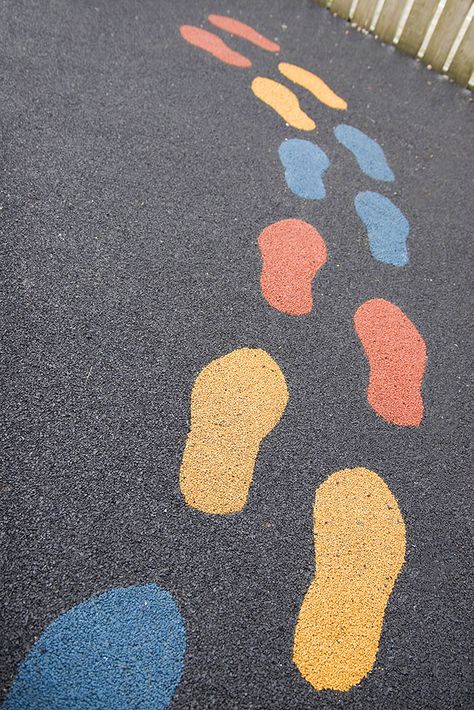 Footstep graphics within playground flooring can be a great way to help children learn to balance or line up.  #Play #Playground #PlayArea #PlaySurfacing #SafetySurfacing #Schools #Nursery #OutoorPlay #Footsteps Diriyah Gate, Architecture Roof, Sensory Path, Playground Surface, Flooring Texture, Playground Flooring, Playground Slide, Roof Windows, Robert Burns