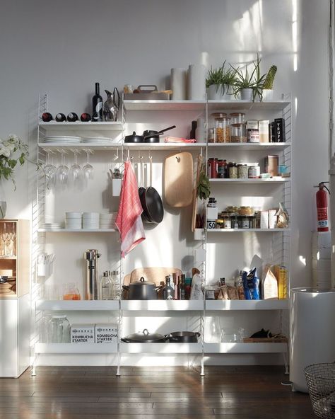 Get your kitchen organized in one fell swoop! Modular, adaptable String Kitchen Shelving makes it easy to move shelves and customize… Ikea Apartment Ideas, Ikea Apartments, Modern Kitchen Storage, Kitchen Shelving, Kitchen Cupboard Storage, Wall Shelving Units, Small Apartment Interior, Pantry Shelving, Apartment Makeover