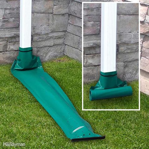 There is no perfect way to get water from one side of a sidewalk to the other, but consider installing a retractable downspout. It rolls out when it rains and then rolls back up when the water stops flowing. Products like these do leak when the water flow is too light to extend the plastic downspout, but they should keep your landscaping from washing away during moderate to heavy rains. Retractable downspouts are super easy to hook up, and they might be just the solution you're looking for. P... Gutter Drainage Ideas, Gutter Extensions, Drainage Ideas, Gutter Drainage, Diy Gutters, Yard Drainage, Gutter Repair, Drainage Solutions, Rain Gutters