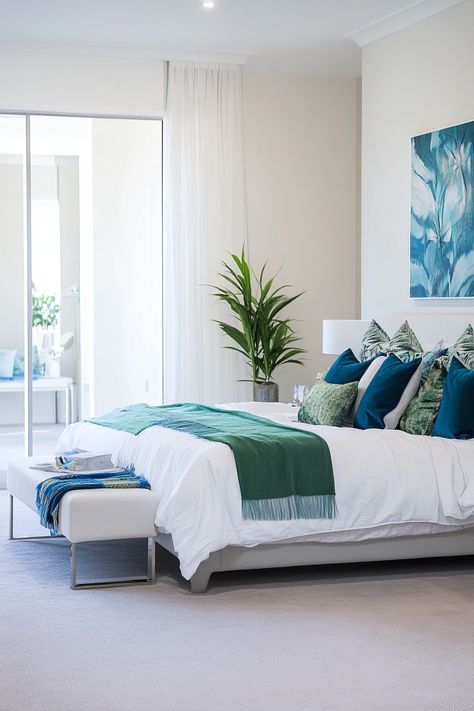 Discover your dream bedroom with these 25 blue and green bedroom ideas. Explore a variety of styles, from classic and timeless to modern and bold.  Dive into the world of blue and green bedroom aesthetics and discover how to effortlessly blend these colors for a truly transformative space. Whether you're looking for blue and green bedrooms ideas for a cozy reading nook or a luxurious master suite, this collection has something for everyone. Blue And Green Bedrooms, Blue Green Bedroom Ideas, Blue And Green Bedroom Ideas, Green Bedrooms Ideas, Blue And Green Bedroom, Teal And White Bedroom, Blue Green Bedroom, Green Striped Wallpaper, Sage Green Curtains