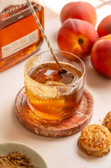 This peach cobbler old fashioned is a peachy spin on the traditional old fashioned and combines all the best flavors from a peach cobbler and transforms it into a very drinkable bourbon cocktail! It starts with a peach, maple syrup, brown sugar, cinnamon, and vanilla syrup, then mixes it with bournon and black walnut bitters. Peach Old Fashioned, Peach Bourbon, Cocktail Shots, Vanilla Syrup, Boozy Desserts, Bourbon Cocktails, Peach Cobbler, Black Walnuts, Cobbler