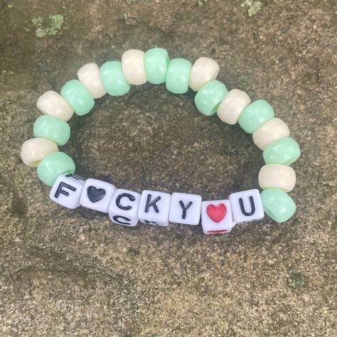 F<3ck You Green And Cream Funny Bead Bracelet Osfm Nwt *1 Bead Bracelet That Says F<3ck You And The U& O Is A Heart With Light Green And Cream Beads *One Size Fits Most *Handmade *New Check Out Our Other Handmade Bracelets And More! Brackets Ideas Clay Beads, Green Day Bracelet, Cavetown Bracelets, Funny Beaded Bracelets Words, Candy Bracelet Ideas, Funny Bracelet Ideas, Funny Kandi Bracelets, Funny Friendship Bracelets, Funny Bracelets Beads Words