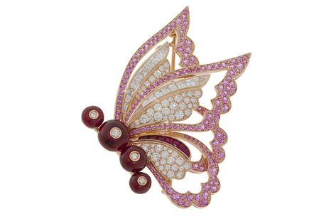 Inspired by Peter Pan’s Tinkerbell, the Fairy Wings brooch in pink gold is embellished with four ruby beads, seven buff-top rubies, 19 step-cut diamonds as well as pave-set pink sapphires and pave-set diamonds Fairy Jewellery, Antique Cushion Cut, Bulgari Jewelry, Antique Cushion, Diamond Butterfly, Fairy Jewelry, Ruby Beads, Pretty Pins, Pear Cut Diamond