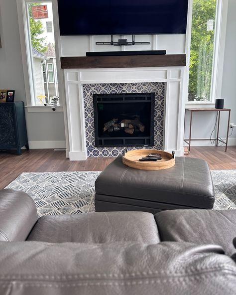 We know it's still summer, but this fireplace is making us crave some cold weather and hot cocoa! We love the use of these unexpected vertical lines that adds some texture and interest to the hearth in both a modern and cozy way! Also, if you want a fireplace remodel before the holidays, now is the time to be chatting! Scroll through for inspo! Would you like a fireplace in your home? Tell us in the comments! . . . . . #MinneapolisRemodel #HomeRenovation #TwinCitiesRemodel #TwinCities... Peninsula Fireplace Mantle, Tile In Front Of Fireplace, Fireplace Remodel Ideas, Fireplace Remodel, White Tiles, Fireplace Mantle, Home Renovation, Home Remodeling, Fireplace