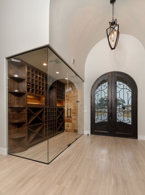 This wine room takes "standing in the cold" out of the equation. Hidden Wine Room, Diy Wine Closet, Closet Wine Cellar Ideas, Glass Wine Room, Wine Nook, Cellar Ideas, Glass Wine Cellar, Wine Storage Cabinets, Wine Rooms