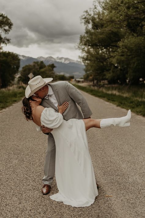 Cowboy Boot Bride, Bride And Groom Cowboy Boots, Groom In Cowboy Boots, Wedding With Cowboy Boots, Bride In Boots, Cowboy Hat Wedding Pictures, Groom Cowboy Hat, Cowboy Boots For Bride, Western Wedding Dresses With Boots