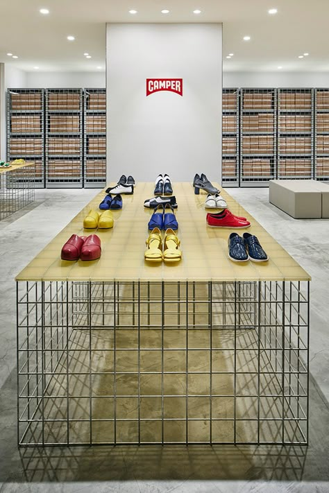 schemata architects have devised a flexible grid system for camper shop in tokyo inside the shin marunouchi building Schemata Architects, Shoes Display, Shoe Store Design, Store Architecture, Wine Shelf, Camper Store, Vintage Stores, Industrial Minimalist, Retail Inspiration