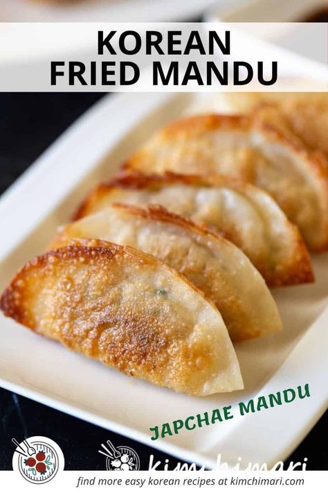 Yaki Mandu, Gun Mandu or Korean Fried Dumplings are light and crispy on the outside while soft and savory in flavor on the inside. They are filled with japchae noodles, veggies, tofu, kimchi, pork and beef and makes an awesome party appetizer or banchan. #koreanfood #potstickers #koreanrecipes #dumplings #koreancooking #mandu Yaki Mandu Recipe, Korean Mandu Recipe, Mandu Recipe Korean, Yaki Mandu, Mandu Recipe, Mandu Korean, Tofu Kimchi, Japchae Noodles, Kimchi Pork