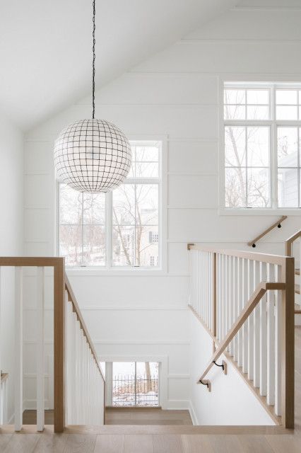 Lenox Road - Country - Staircase - Chicago - by M House Development | Houzz NZ Board And Batten Stairwell, Honeycomb Chandelier, Farmhouse Staircase, House Development, Capiz Chandelier, Trim Board, House Staircase, Board And Batten Wall, Staircase Wall