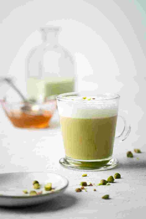 Pistachio Latte Recipe | Cozymeal Pistachio Latte Recipe, Pistachio Coffee, Pistachio Latte, Pistachio Syrup, Pistachio Milk, Lunch Sides, Brunch Desserts, Lavender Syrup, Turmeric Latte