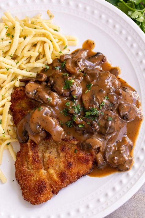 Jägerschnitzel, or Hunter’s Schnitzel, is a popular German dish of fried pork cutlets topped with luscious mushroom gravy. With a crispy crust and tender, juicy interior, schnitzel just can��’t be beat. Finishing it with a classic jägersoße (hunter’s sauce) is one of the best ways to enjoy it! German Schnitzel With Mushroom Gravy, Hunters Gravy, Schnitzel Gravy Recipe, Fried Pork Cutlets, Easy Italian Meatloaf, Jaeger Schnitzel, Pork Schnitzel Recipe, Brown Gravy Recipe, Schnitzel Recipes