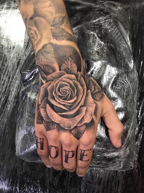 Tattoo Rose On Hand, Hand Rose Tattoos For Guys, Men Hand Rose Tattoo, Roses Tattoo Hand, Rose Tattoo Design On Hand, Hand Roses Tattoo, Hand Tattoos Men Rose, Rose Hand Tattoo Men Design, Rose Tattoo Designs Men