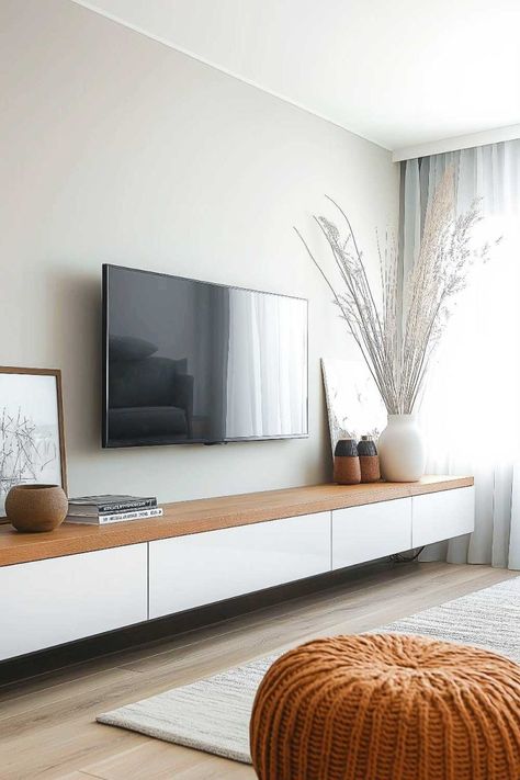 tv_unit_minimalist_living_room_designs (21) Tv Unit Decor Minimalist, Tv On Living Room Wall, Hung Tv Ideas Wall, Minimal Apartment Decor Living Room, Boho Media Room, Tv Unit On Wall, Minimalistic Tv Wall Design, Lounge Room Tv Wall Ideas, Minimalist Living Room Tv Wall